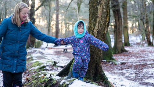 Visitors in the woodland in winter at Alderley Edge and Cheshire Countryside, Cheshire